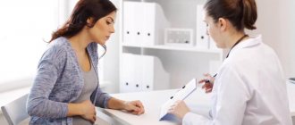 Pregnant woman and doctor