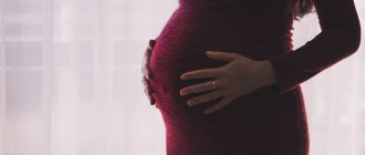 The photo shows a pregnant woman.